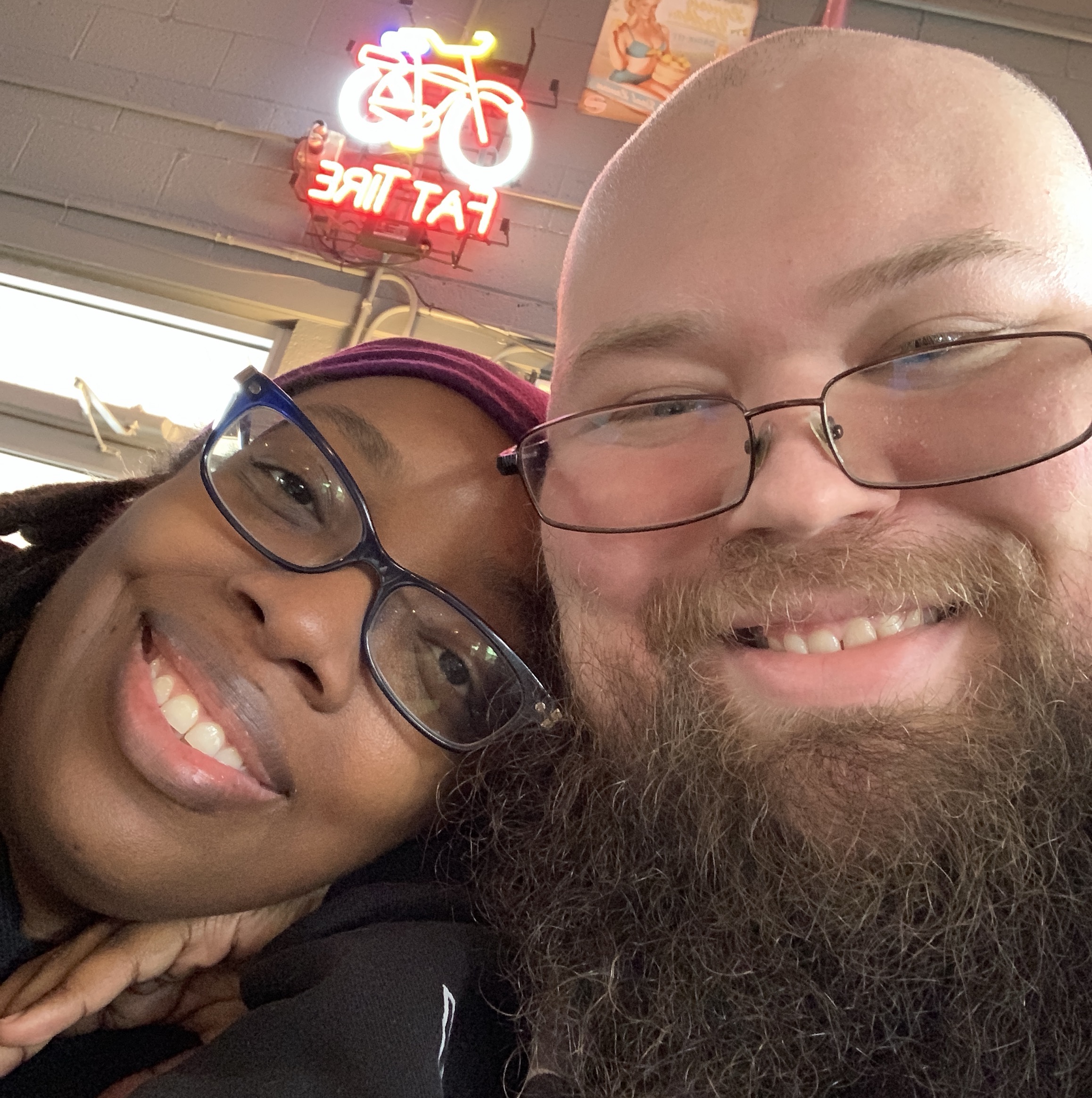 Keith and Kirsten smiling together indoors.